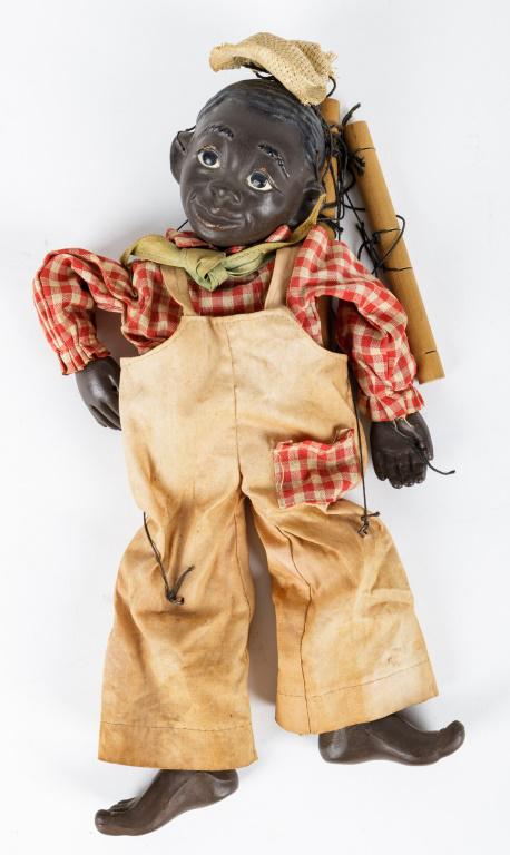 Black Americana Marionette: Black Americana marionette measures approx 12". Appears to be made of red clay. There is some staining and loss to the clothing and the eye lids and lips have paint loss, hat is slightly bent. See pho