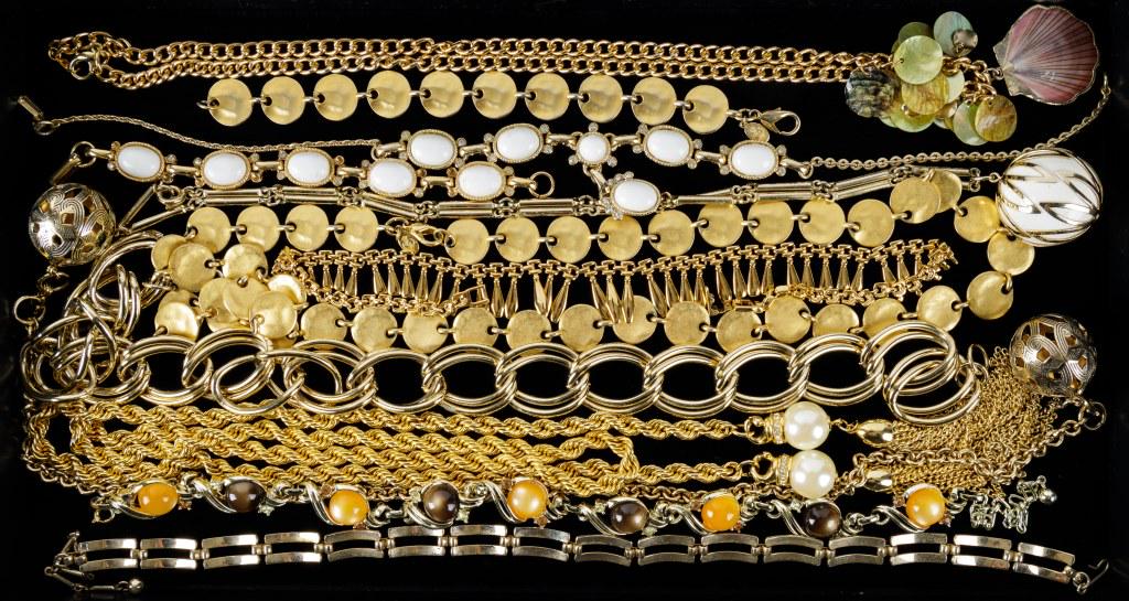 Gold Tone Costume Jewelry: There are approx 10 pieces of gold tone jewelry including necklaces and bracelets. Sarah Coventry, Premier Designs are a couple names that have been identified. Good condition.