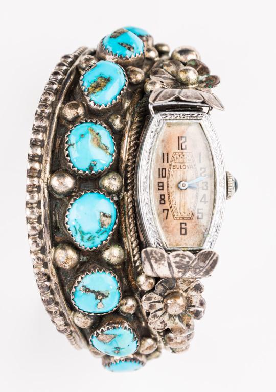 Antique Signed Native American Sterling Turquois: Early Native American "Jameson Lee" signed sterling silver unsigned eight piece bright blue turquoise cuff/watch bracelet with Bulova wind up watch in found condition. ...