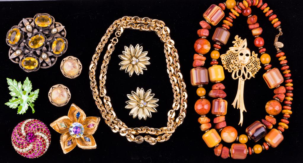 Vintage Costume Jewelry (9): Lot of 9 includes Miriam Haskell amber and stone necklace (longest, approx 30" L), gold tone necklace, gold tone floral brooch marked Wagner, round pink brooch marked ART, 3 more brooches, 2 pairs of 