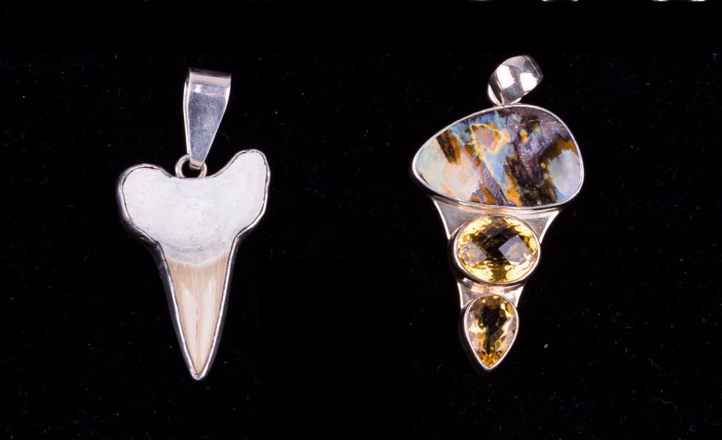 Charles Albert Sterling Silver Pendants (2): Two Charles Albert sterling silver pendants, a shark's tooth measuring approx 2.25" L and another approx 2 3/4" L with cut stones that test in the citrine range.