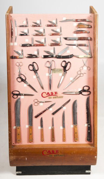 "Case xxx" Knife Store Display: "Case xxx" knife store display containing thirty of the original store display knives, ten scissors, and four kitchen knives; display is from a country store active into the 70s, 43"h x 24"w x 24 1/2"