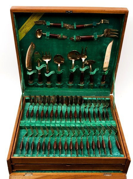 Samron Thai Brass Flatware: One hundred and forty three pieces of Buddhist themed Samron brass flatware in a velvet lined case