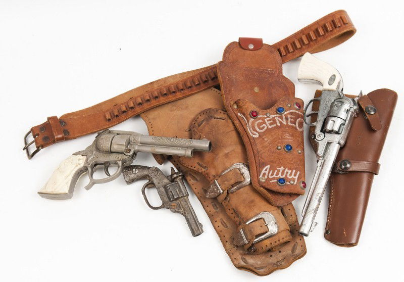 Cap Guns and Holsters: Champion cap gun with belt and holster with another cap gun marked H with holster and another cap pistol with holster
