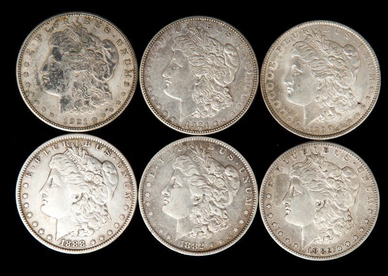 Six Morgan Silver Dollars: Six Morgan silver dollars including 1882S, 1882-O, 1880, 1890 an two 1921S, ungraded