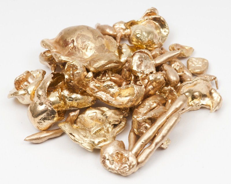 Gold Lot: 18K yg grouping of several melted down pieces of gold, approximately 33.5dwt