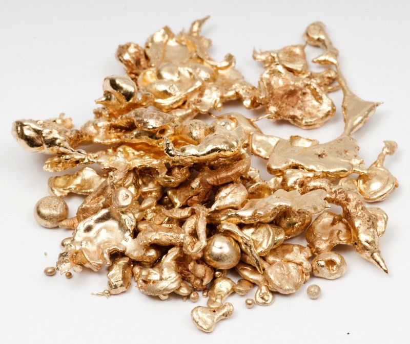 Gold Lot: 18K yg grouping of several melted down pieces of gold, approximately 40.3dwt