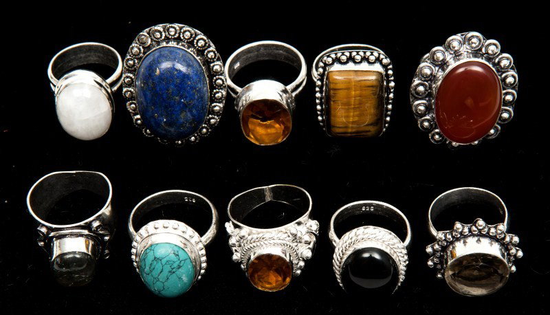 Ten Sterling Rings: Containing various cabochons and faceted stones such as labradorite, lapis, tiger eye, carnelian, black onyx, glass, etc., 3.47ozt
