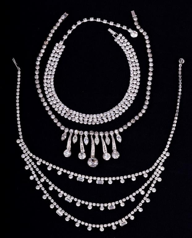 Vintage Rhinestone Necklaces: Lot of 3 rhinestone necklaces includes a band choker (approx 15" L), Kramer triple strand (approx 15" L) and another with teardrops (approx 15" L).