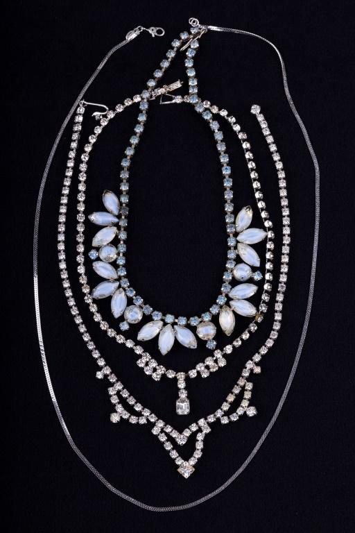 Vintage Rhinestone Necklaces & Monet: Three vintage rhinestone necklaces including cloud rhinestone (approx 13" L) and two more. There is also a silver tone Monet chain measuring approx 24" L.