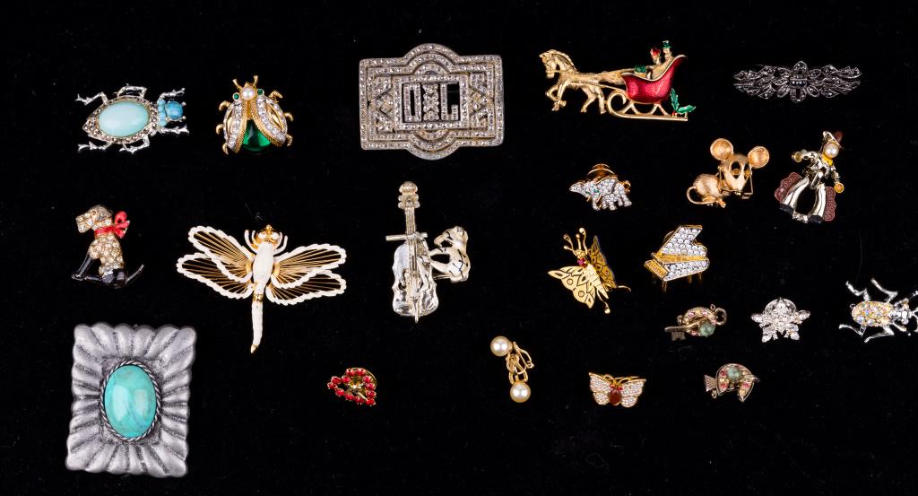 Vintage Costume Jewelry Grouping: Lot of vintage jewelry includes a variety of brooches, many with insect themes, Napier, Christmas sleigh marked Gerry's, BRKS and a jelly belly insect brooch and Coro dog. All others are unmarked.