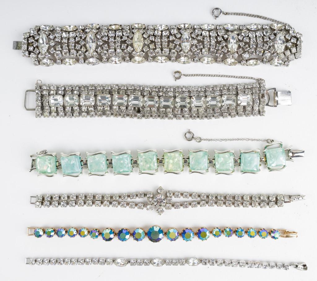Vintage Costume Jewelry Bracelets: Lot of 6 rhinestone bracelets includes one small clear stone bracelet marked Kramer, another bracelet marked La Rel, green tone bracelet marked Coro and 3 more. Bracelets have an average length of 7"