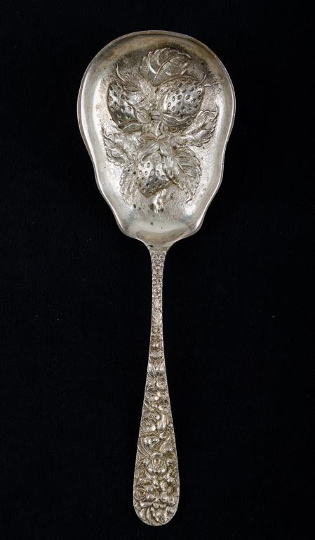 S. Kirk & Son Sterling Silver Repousse Flatware: Large sterling silver S. Kirk & Son repousse strawberry / fruit serving spoon, measuring approx 8" L. Weighs approx 2.9 ozt.