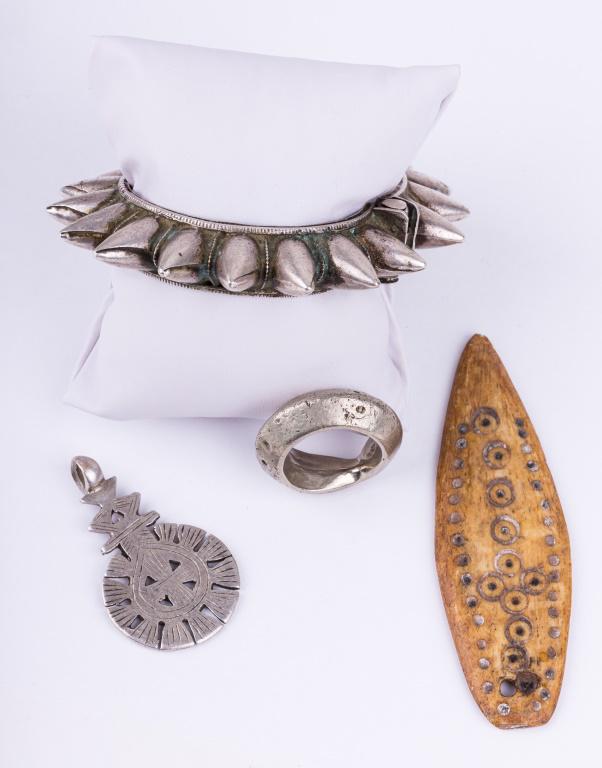 Antique Ethiopian Coin Silver Jewelry: Antique Ethiopian coin silver "solve" jewelry including a spike bracelet (approx 2" inner dia), pendant (approx 3.75" L), ring (approx size 9.5) and a carved bone pendant. Total weight approx 3.73 ozt