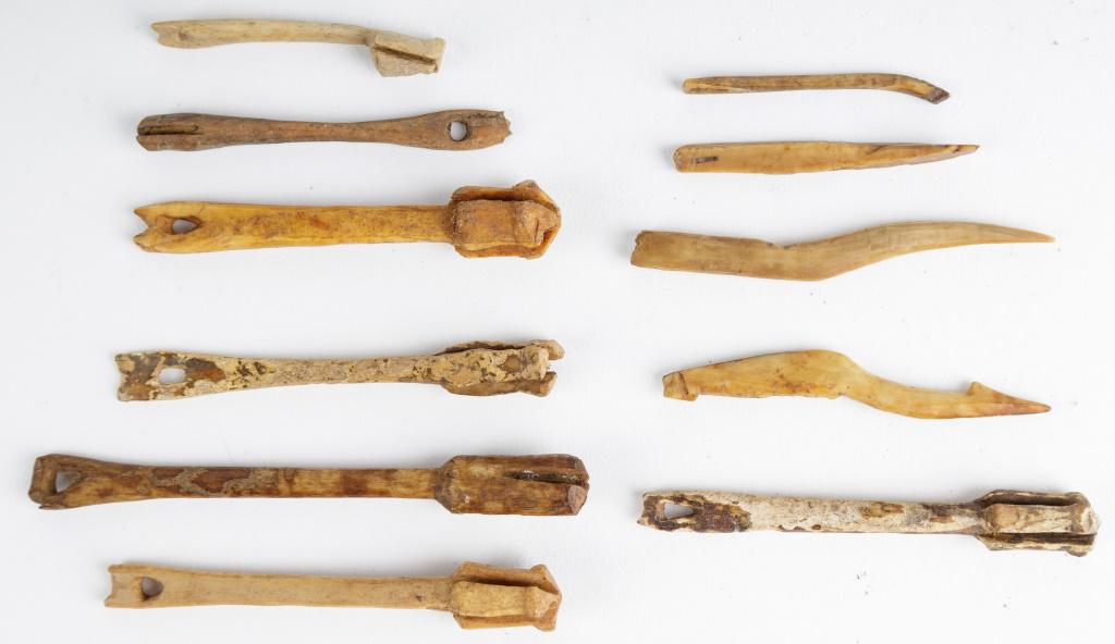 Antique Inuit Fish Hook Parts: Antique Inuit inupiaq (Inupiak) artifacts from Savoonga, Wales & Koyuk, Alaska. This lot consists of assorted shanks and prongs used for making fish hooks (11 pieces). Made from carved walrus. They ha