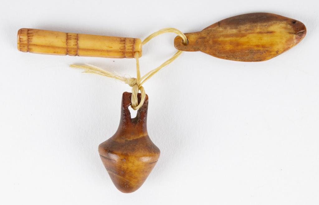 Antique Inuit Carved Pendants: Antique Inuit inupiaq (Inupiak) artifacts from Savoonga, Wales & Koyuk, Alaska. There are 3 carved pendants including a fish, totem and another. Longest is the fish, measuring approx 1.5".