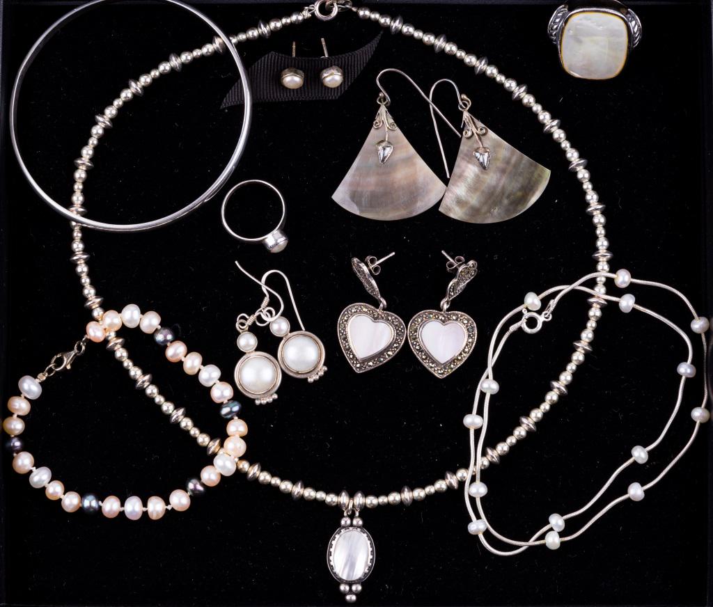 Sterling and Pearl Jewelry: Group of sterling silver and pearl jewelry featuring a 17 1/2" sterling bead necklace with a mother-of-pearl pendant; sterling and abalone earrings; sterling and pearl stud earrings; a 5mm wide sterli