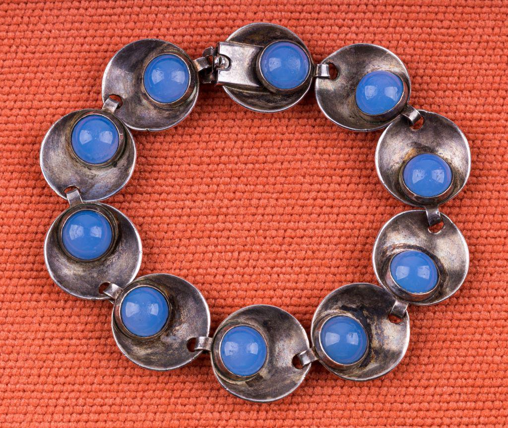 Hermann Siersbol Vintage Sterling Bracelet: Beautifully designed Hermann Siersbol vintage sterling bracelet. This modernist Danish bracelet measures 7 1/4" with the latch closed. It features 10 sterling bowl shaped links with a set moonstone in