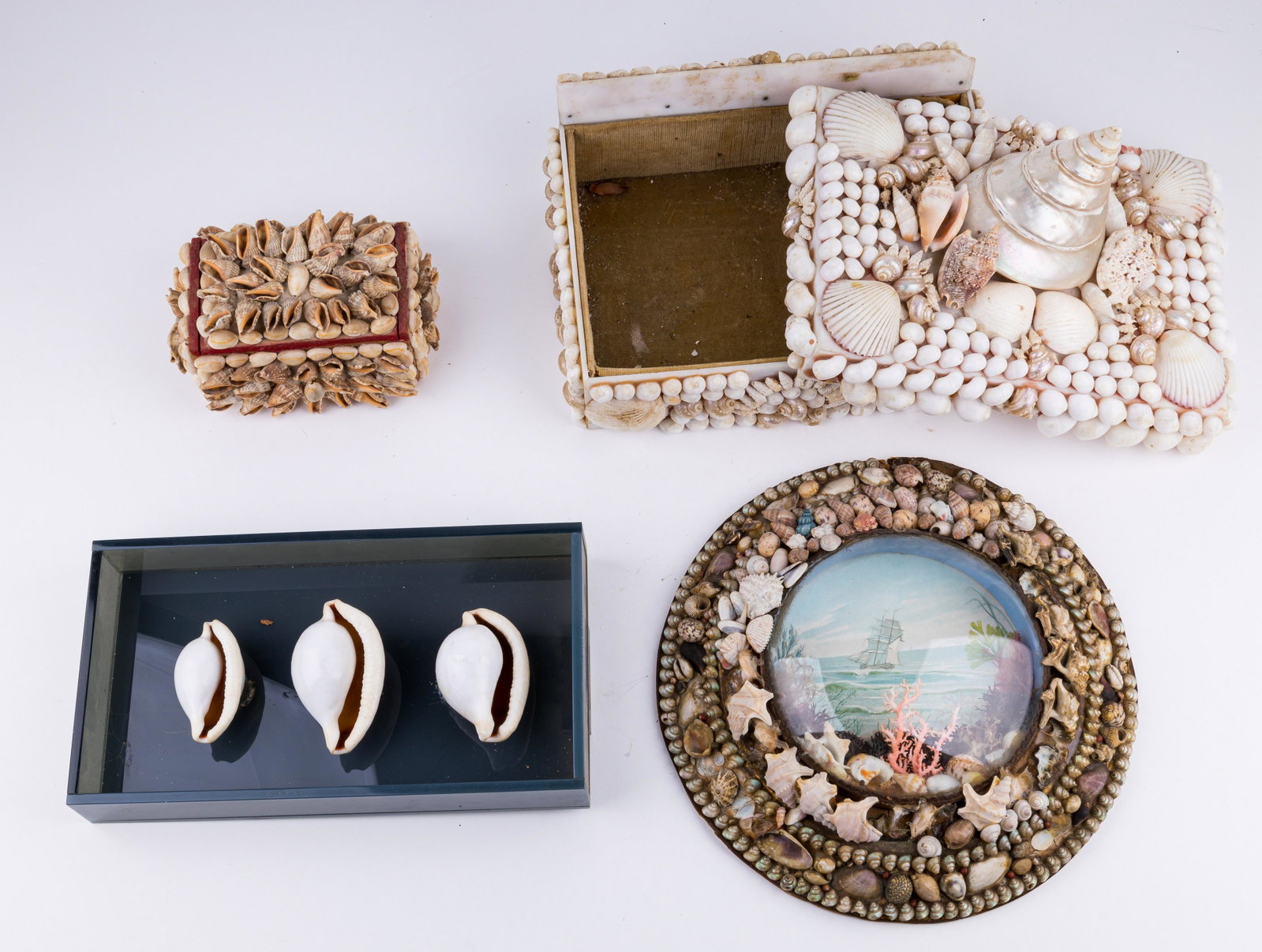 Victorian Style Boxes, Shadow Box & Wall Art: Lot includes two sailor's sweetheart style boxes, round wall art and a shadowbox with three shells. The lucite box with shells is the largest, measuring approx 8" x 11" x 8" and the round wall art mea