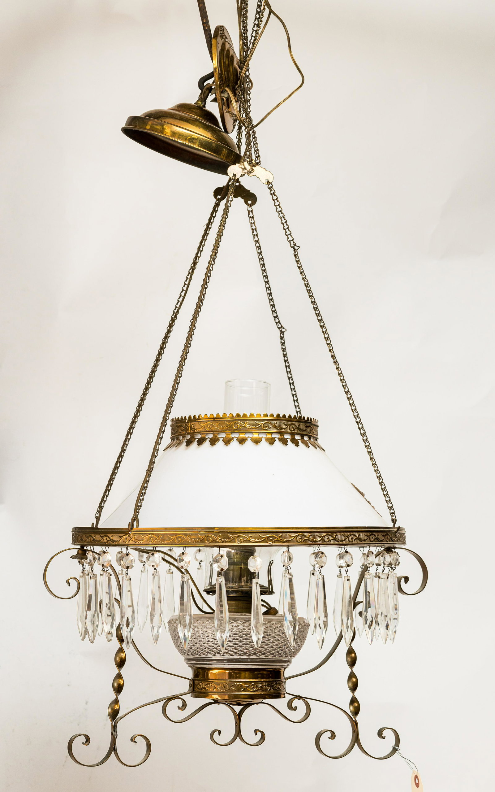 Country Store Style Hanging Lamp: Country style hanging lamp with brass accents and teardrop crystals and measures approx 34" H. Comes with counter balancing weight. See photos.