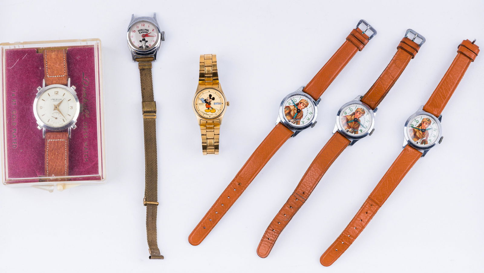 Vintage Pop Culture Wrist Watches: Lot of six wrist watches with various pop culture icons including three Davy Crockett (one is missing the crystal), Hopalong Cassidy, Mickey Mouse (made by Seiko) and a Lynn Deluxe watch. Watches have
