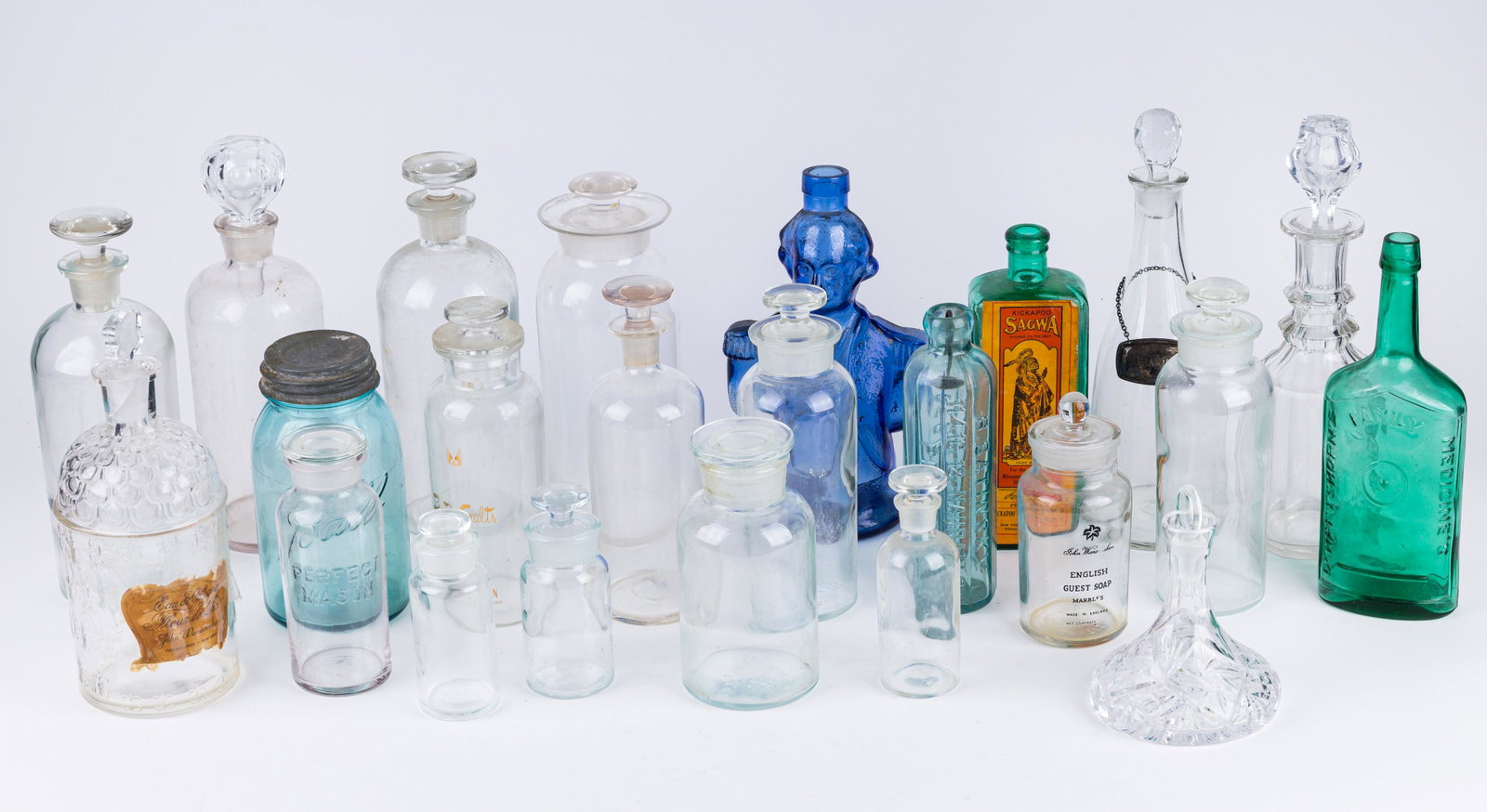 Vintage Decanters and Bottles: 19th and 20th century bottles and decanters including bottles from B.S. Satinsky Philadelphia, Dr Hart Shorns, bottle made by Crawford China Co, Kickapoo Indian Medicine Co, Charles Jacquin bottle, a 
