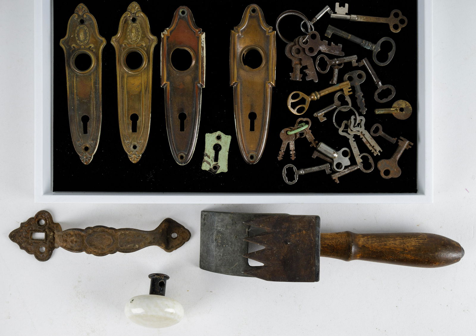 Antique Keys & Vintage Hardware: Lot includes 25 keys, five door escutcheons, white porcelain door knob, cast iron door latch handle and a 1884 North Brothers Manufacturing Philadelphia ice shaver.