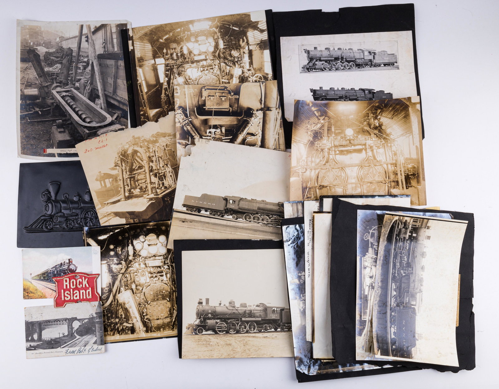 Vintage Railroad Photographs: Lot of 20+ various black and white photos of trains including steam engines and parts. Some are mounted on paper. There is also a plastic steam engine plaque. See photos.