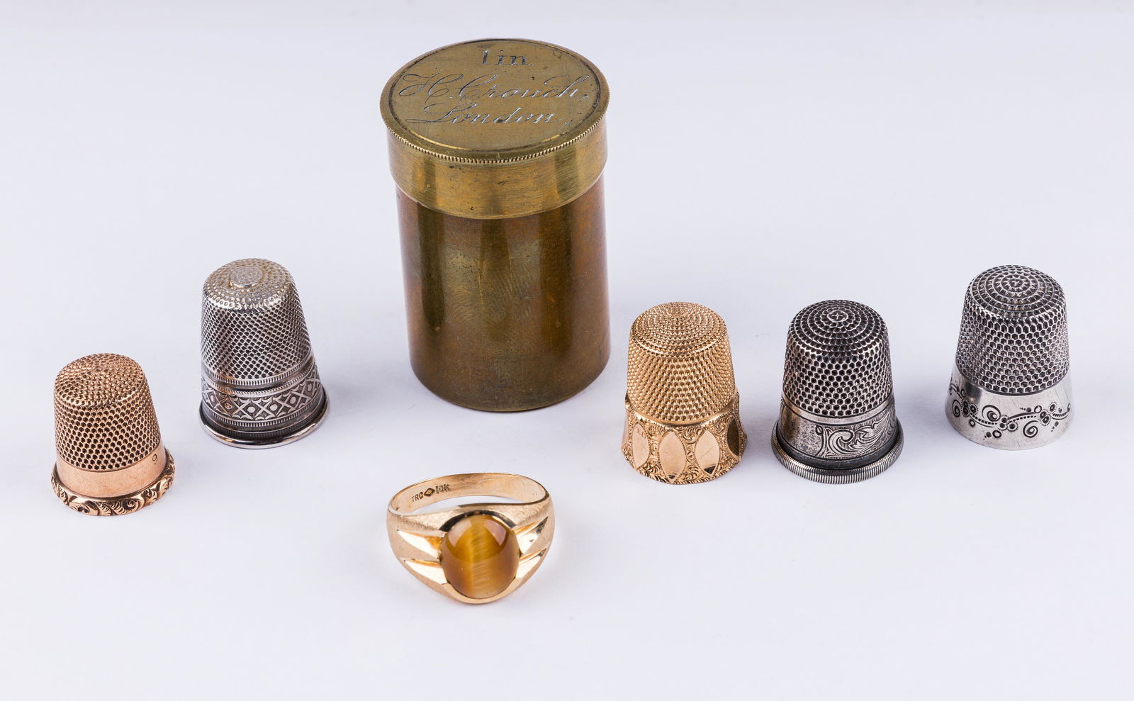 Vintage Gold & Silver Thimbles, Ring & More: There are five thimbles including three sterling silver (approx 9.06 dwt), 9K gold thimble (dark, approx 2.05 dwt), 10K gold thimble (approx 2.07 dwt), 10K gold ring with tiger eye stone (size 10.5, w
