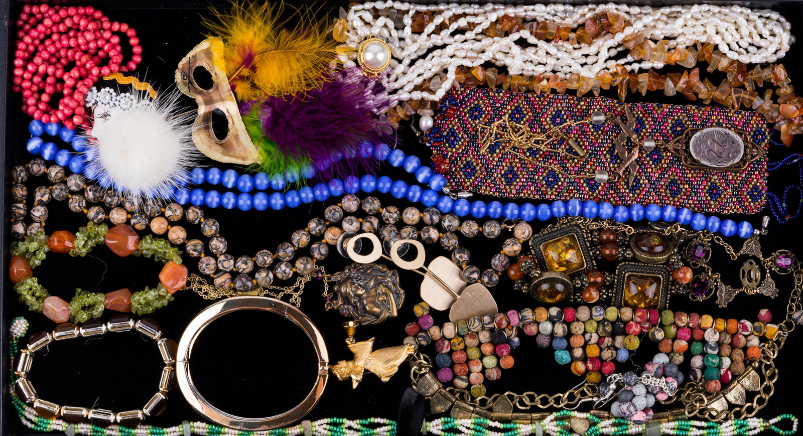 Vintage Costume Jewelry: Lot of costume jewelry including carnelian and peridot chunk bracelet, amber bracelet, freshwater pearl necklace as well as other necklaces, bracelets and more.
