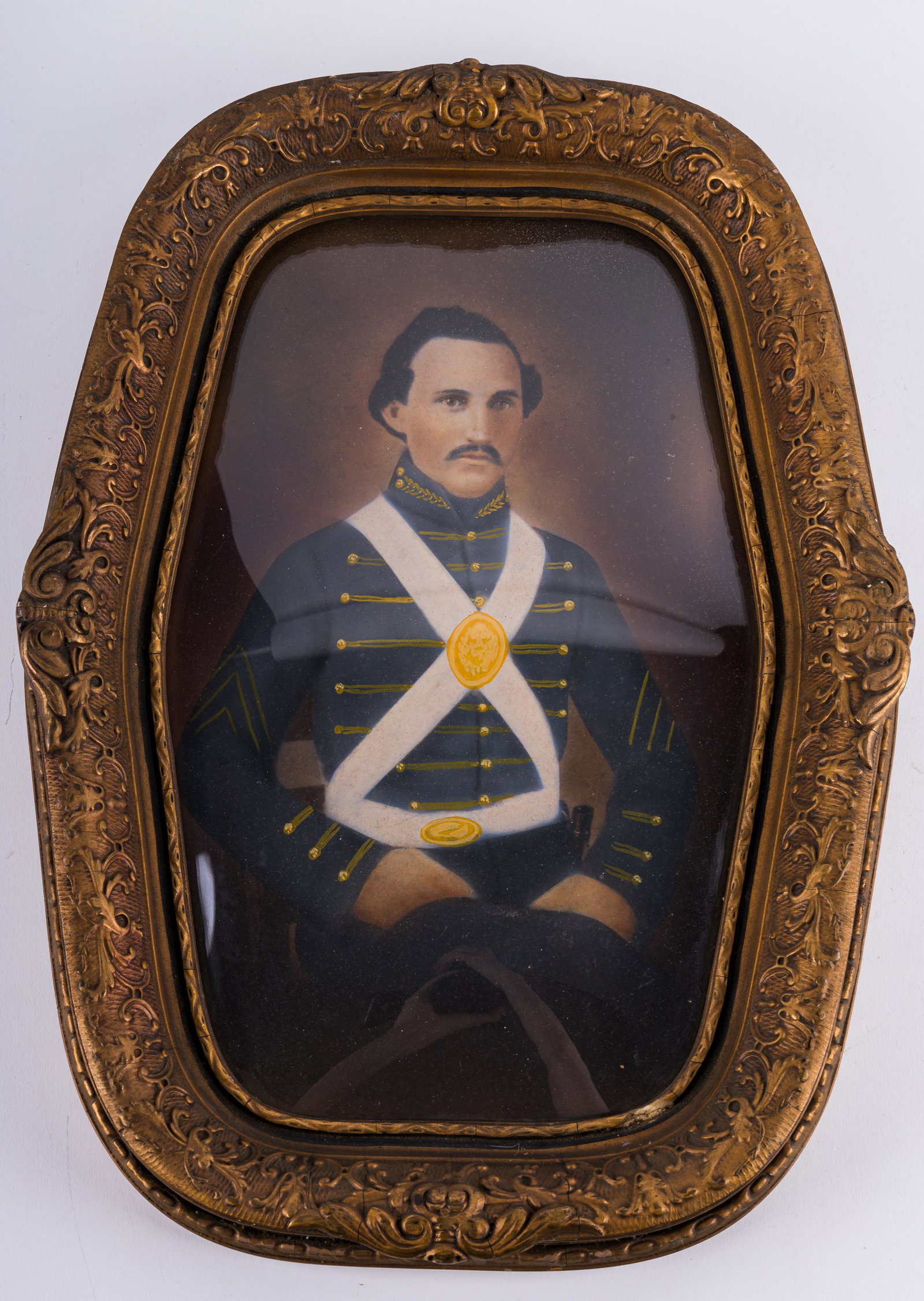 19th Century Antique Soldier Portrait: 19th Century US soldier hand tinted portrait in gilt frame with convex glass. Measures approx 18" x 13.5". There is some loss and cracking to the gilt.