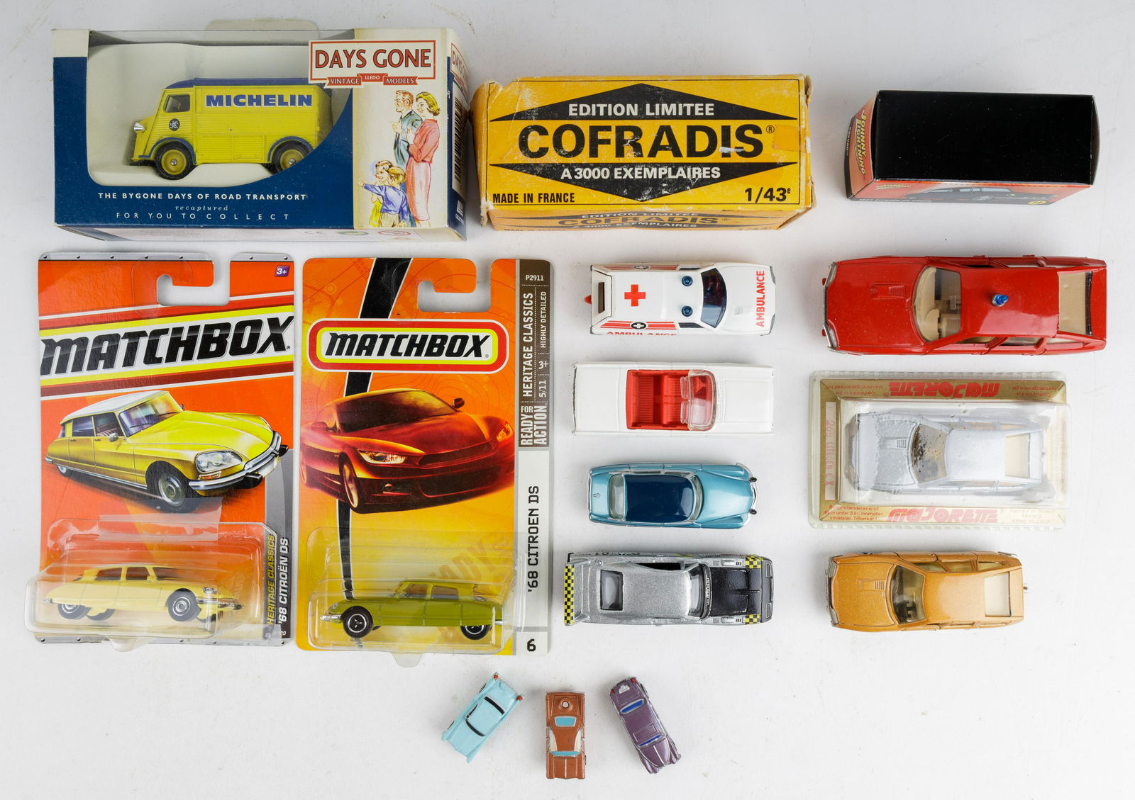 Vintage Die Cast Cars, Citroen and Others: Lot of 15 total pieces including 8 Citroen and others including Matchbox, Johnny Lightning, Majorette and Cofradis. There is also a Michelin truck, 2 Hot Wheels and 3 small die cast.