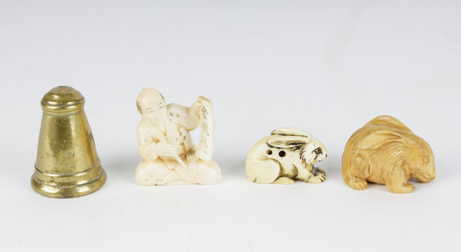 Chinese Netsukes & Victorian Candle Snuffer: Three Chinese netsuke sculptures along with a candle snuffer from the Victorian period.