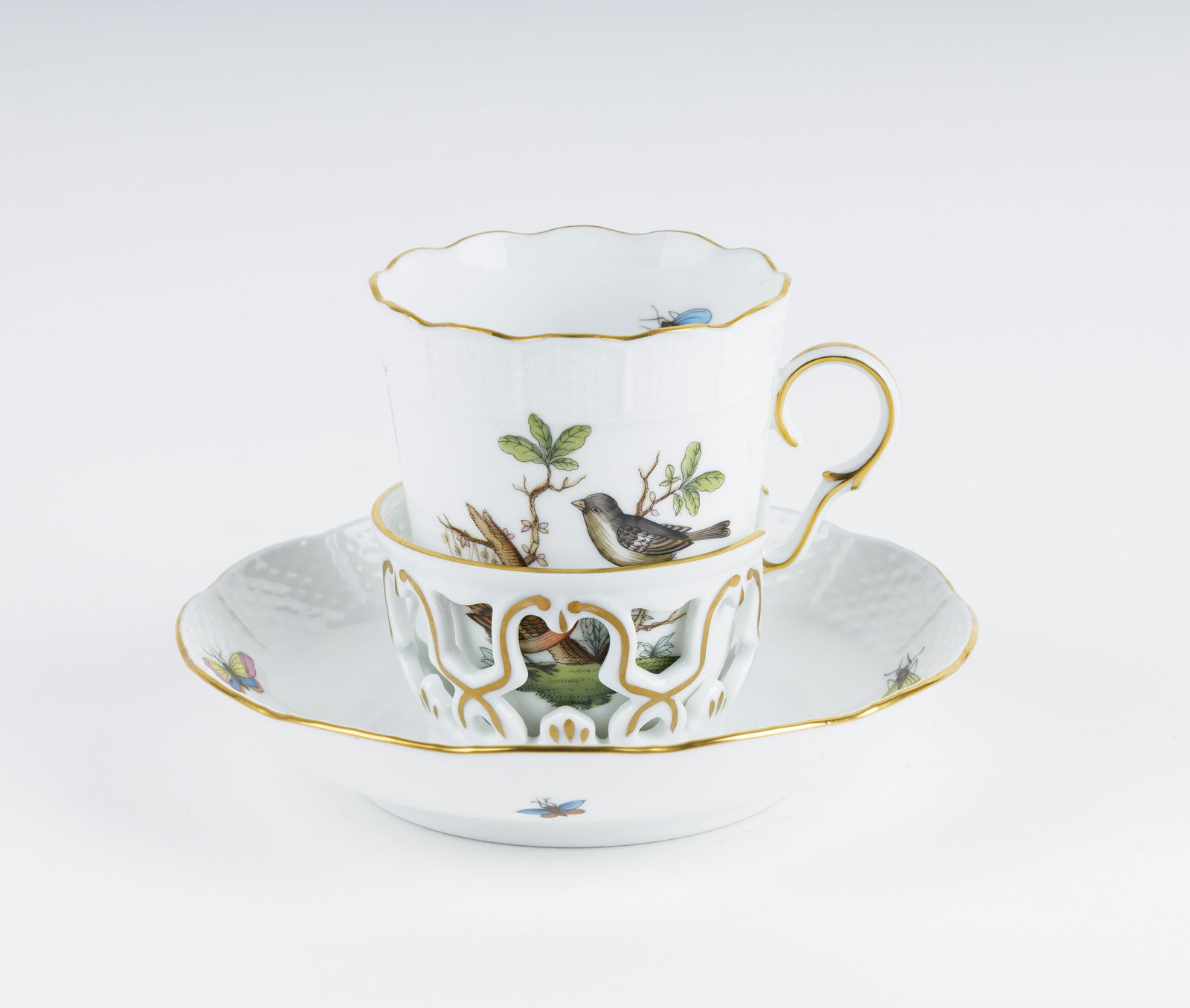 Herend Rothschild Bird Cup & Saucer: Herend "Rothschild Bird" cup and Saucer appear to be in good condition. Saucer is fitted to the tea cup.