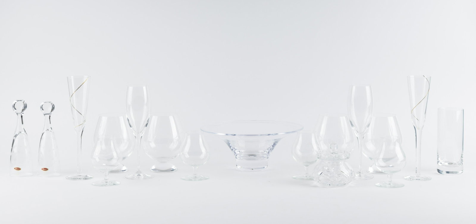 Riedel Brady Snifters: Riedel Brady Snifters measure approx 5.5" H and two 8.5" Riedell wine glasses. Four smaller cordials, pair of Kosta Boda champagne flutes, and commemorative 200 Moser champagnes, one Schott 2 Wiesel w