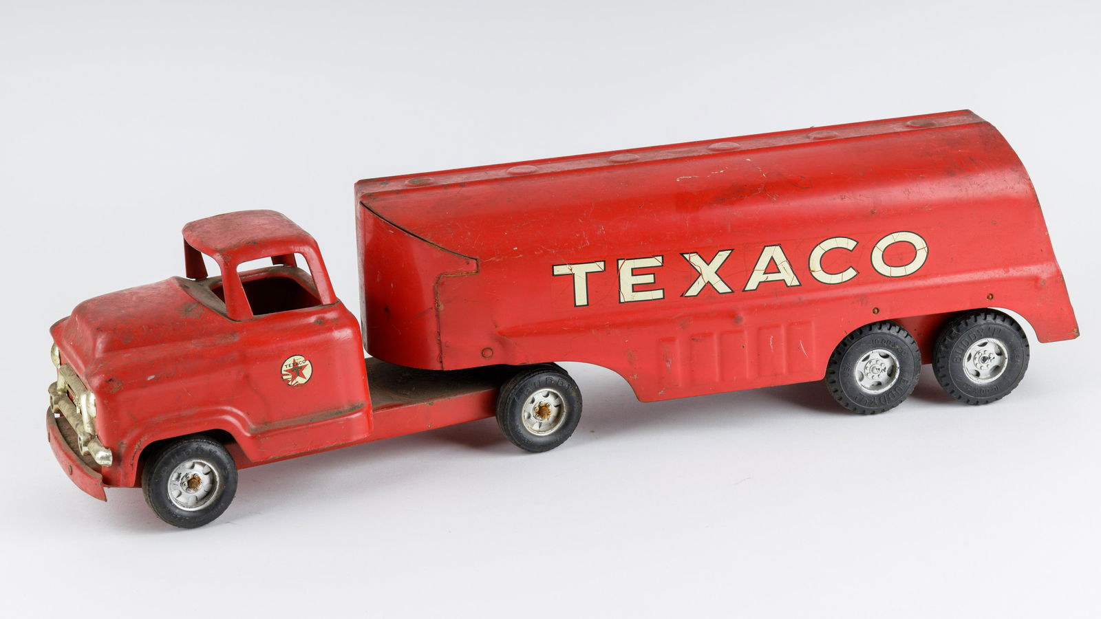 20th C. Buddy L Brand Texaco Tanker: Buddy L branded Texaco truck made from pressed steel during the mid 20th century. Item is in fair condition, with no box included. Truck measures approx 24" L x 6" H.