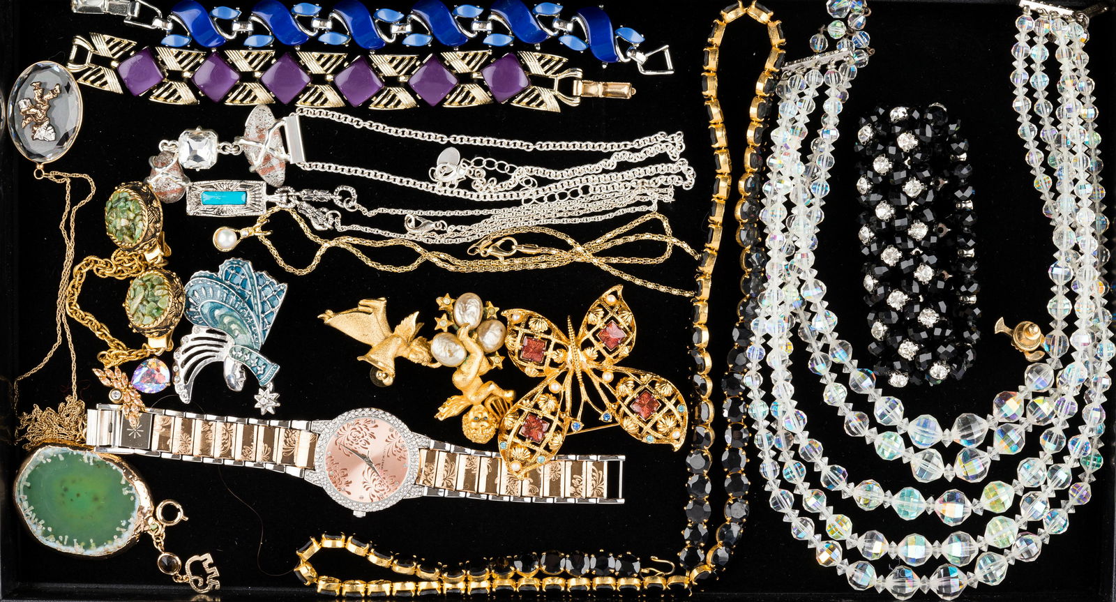 Costume Jewelry (18 pcs): 18 pieces of costume jewelry including names such as Monet, GG and Avon. Longest necklace is black quartz measuring approx 24" L. Watch made by Izaac Mizrahilive. Scarf clip has small jadeite chips.