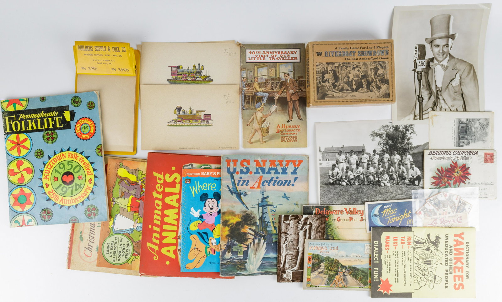 Vintage Books, Magazines & Ephemera: Lot includes four postcards, two advertising ephemera, four children's books, a Navy magazine, Hussy Tobacco pamphlet, three 1950 train prints, a Builder's Supply clipboard, two Pennsylvania Dutch and