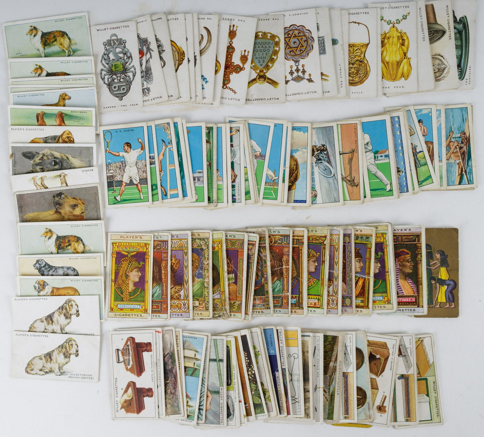 Vintage Tobacco & Cigarette Cards: 39 Gallaher cigarette cards "Champions of Sport" (good to very good), 22 Wills Tobacco "Lucky Charms" (good to very good, 16 Wills Tobacco "Dogs" (fair to good), 20 Player "Ancient Egypt Queens and Ki