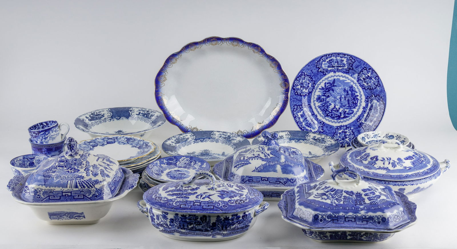 Antique Blue Willow China & More: Lot of antique china includes Blue Willow, Flow Blue and Blue Onion and other blue and white patterns. There are 5 lidded Blue Willow compotes and others include one platter, eight plates (largest 10"