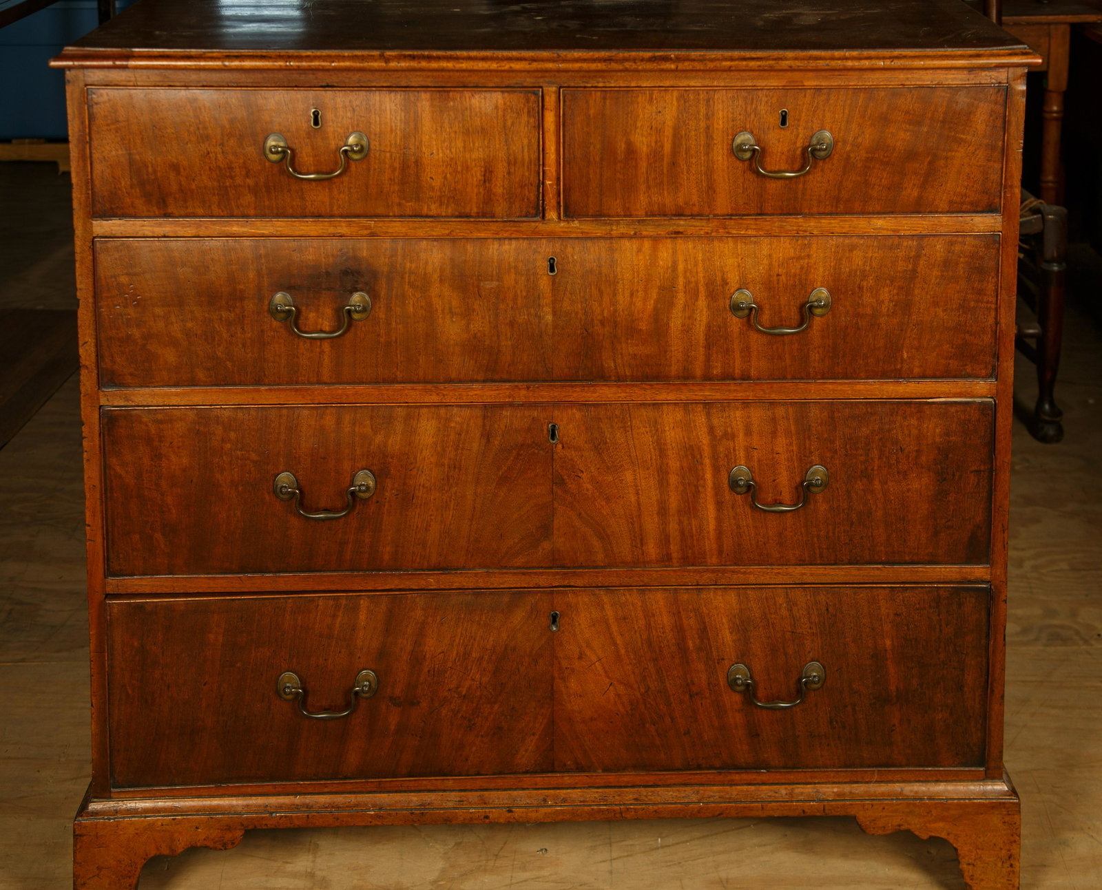 English Mahogany Chippendale Chest of Drawers: It has original bail pulls and measures 41" H x 42 1/2" W x 20 1/2" D. Trim piece and back leg support is in drawer. Furniture Pick-up Availability-We will have staff available at our Hay Street Locat