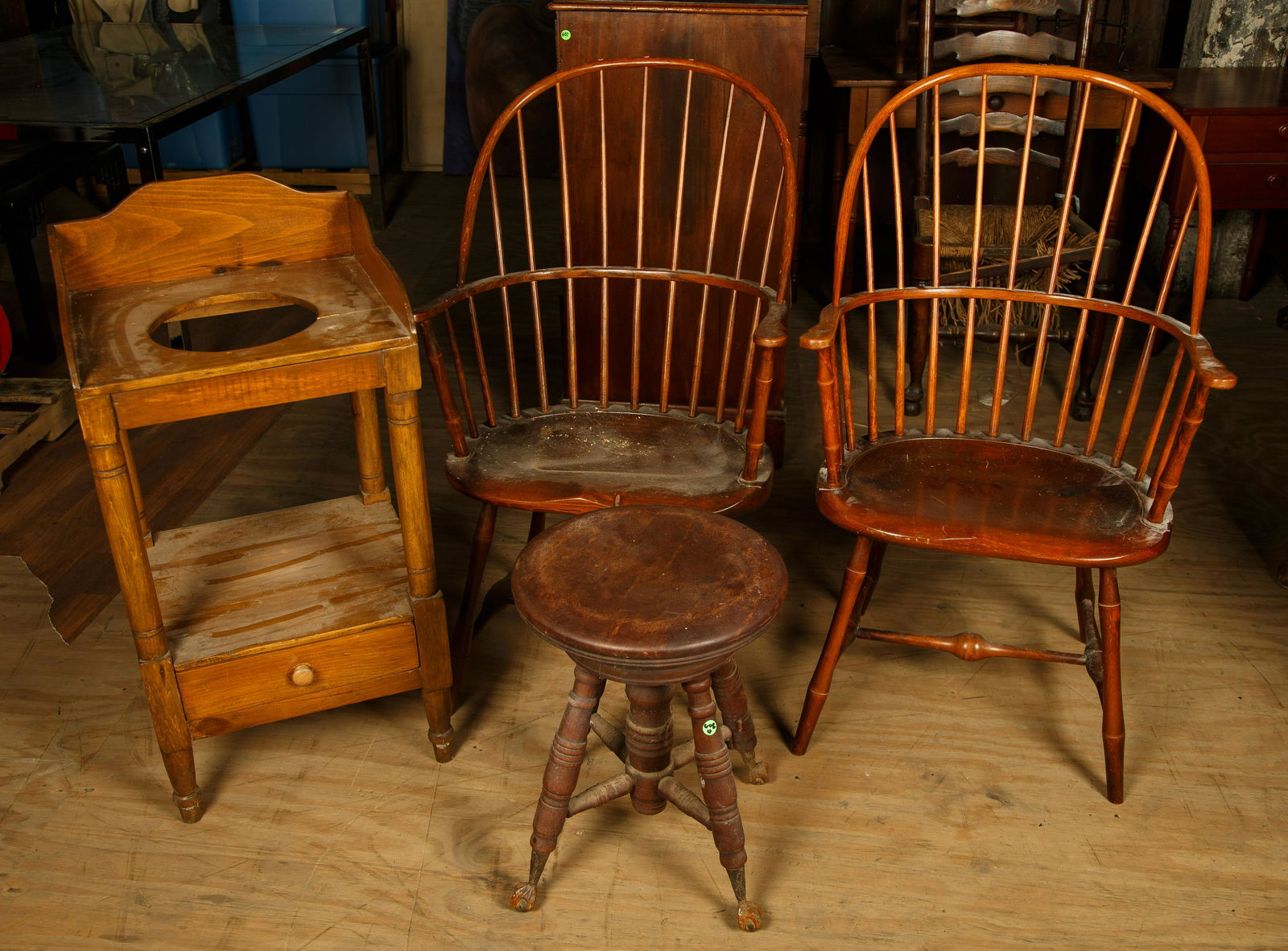 Washstand, Hoop back Windsors, Piano Stool: Piano stool is mahogany and has some oxidation at the feet. The pair of hoop back Windsor Chairs are made by D. E. Partridge. The poplar washstand has basin hole and measures 35" H x 15 1/2" D x 17" W