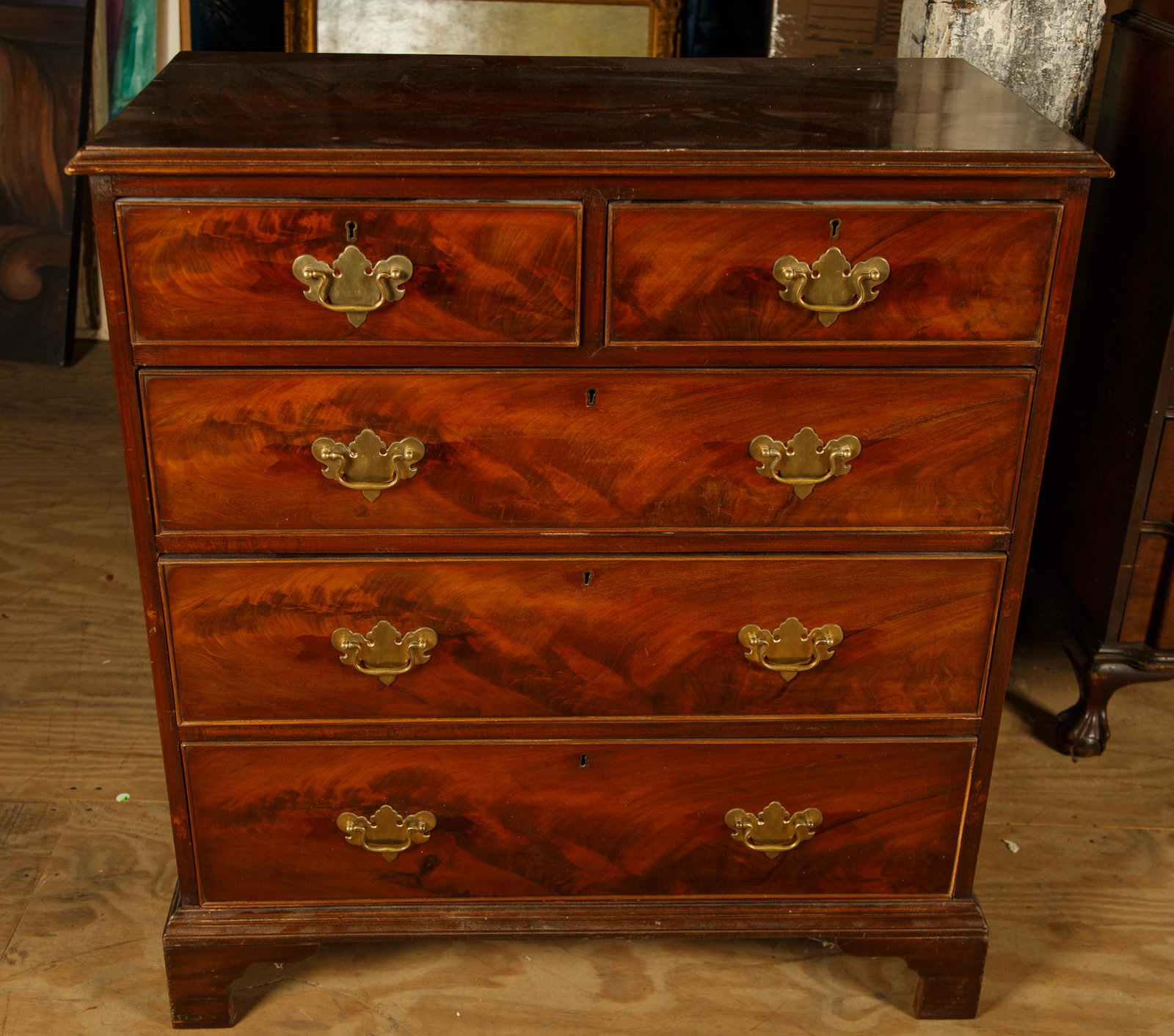 Chippendale Chest of Drawers, Period English: Chippendale mahogany chest of drawers is a period piece, with two drawers over three drawers. It has replaced brass pulls and measures 40" H x 18 1/2" D x 36 1/2" W. Furniture Pick-up Availability-We 