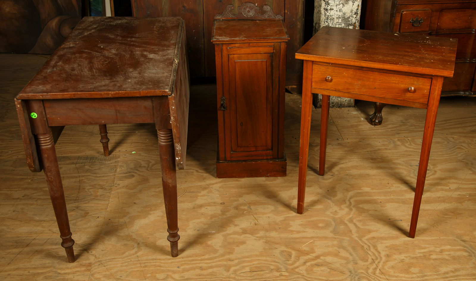 Mahogany Curio Cabinet & Tables: Mahogany early 20th century Curio Cabinet made into a work table, and a circa 1840's drop leaf table. Tallest piece is 29" H. Curio backsplash is loose. Furniture Pick-up Availability-We will have sta