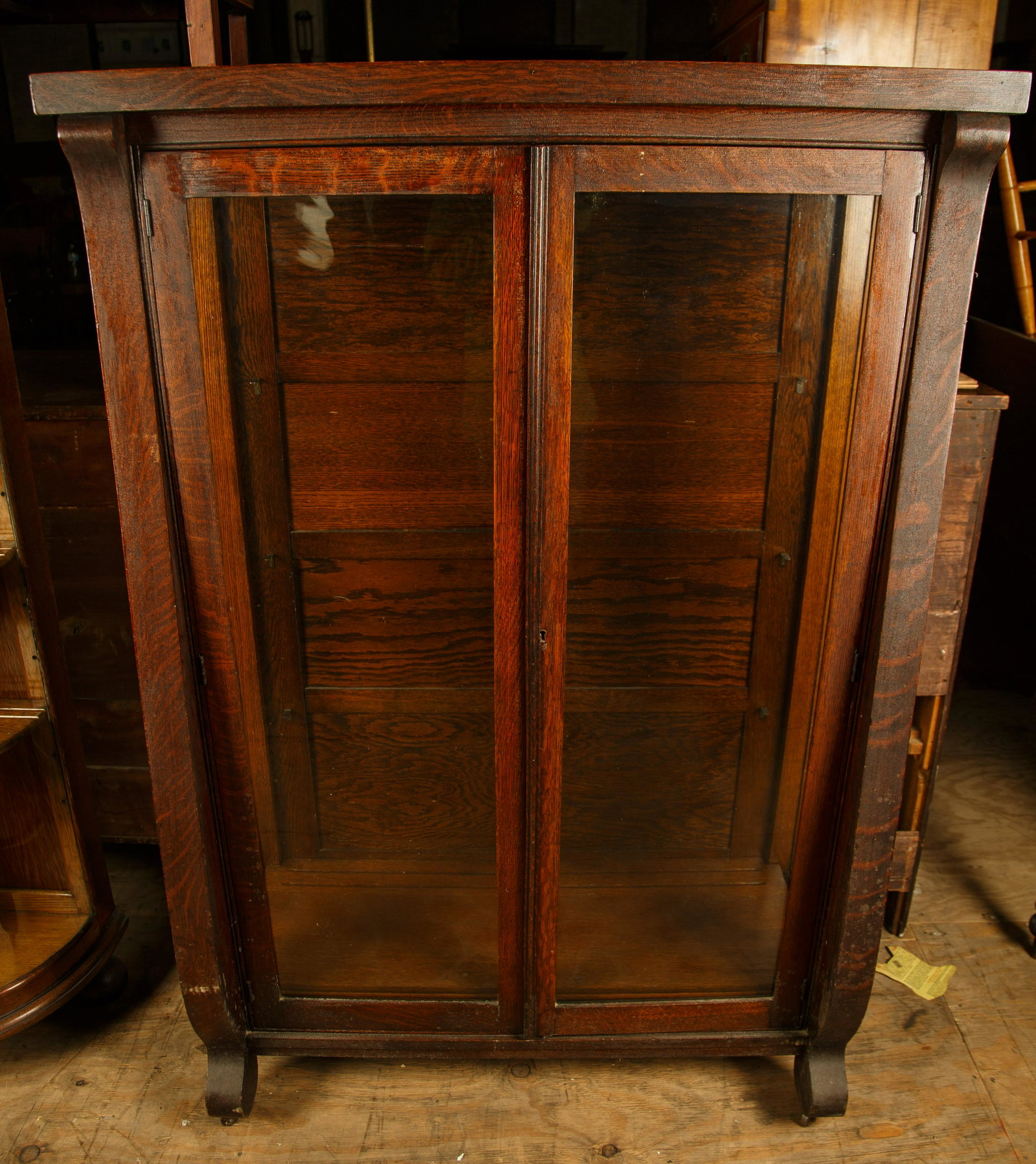 Late Empire Oak Curio Cabinet: Late Empire oak curio cabinet measures approx 60" H x 16" D x 40 1/2" W and has three shelves, plus key. Furniture Pick-up Availability-We will have staff available at our Hay Street Location on Thurs