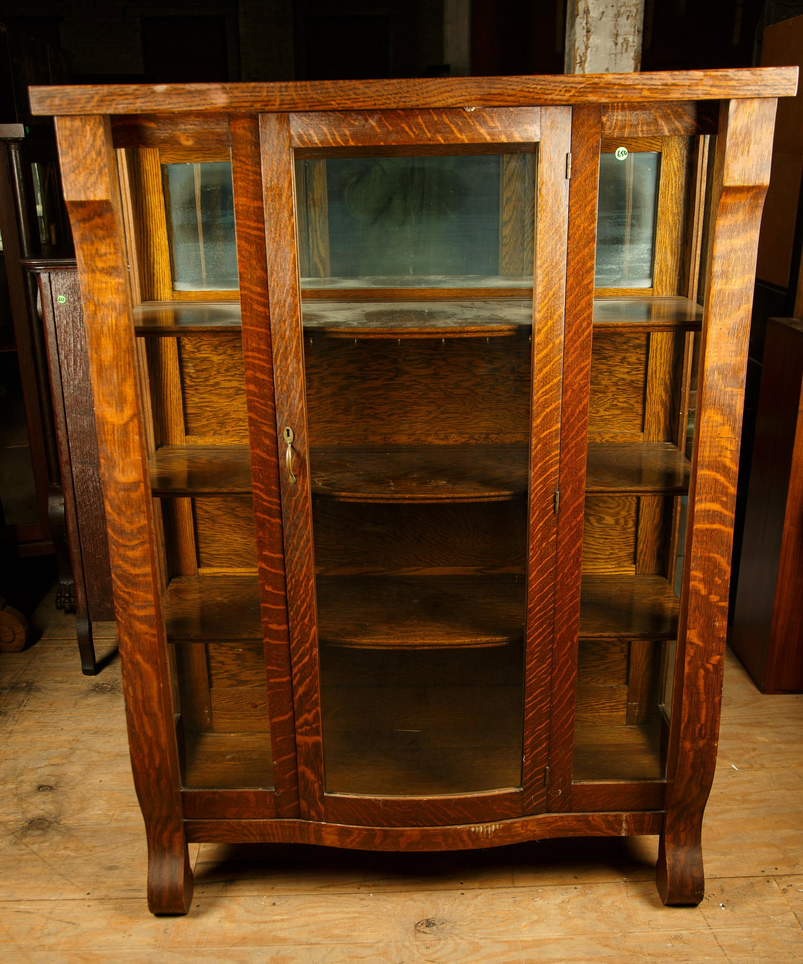 Late 19th C Oak Curio Cabinet: Late 19th C oak curio cabinet measures 61" H x 46" W x 16 1/2" D and has three shelves. Furniture Pick-up Availability-We will have staff available at our Hay Street Location on Thursday the 20th and 