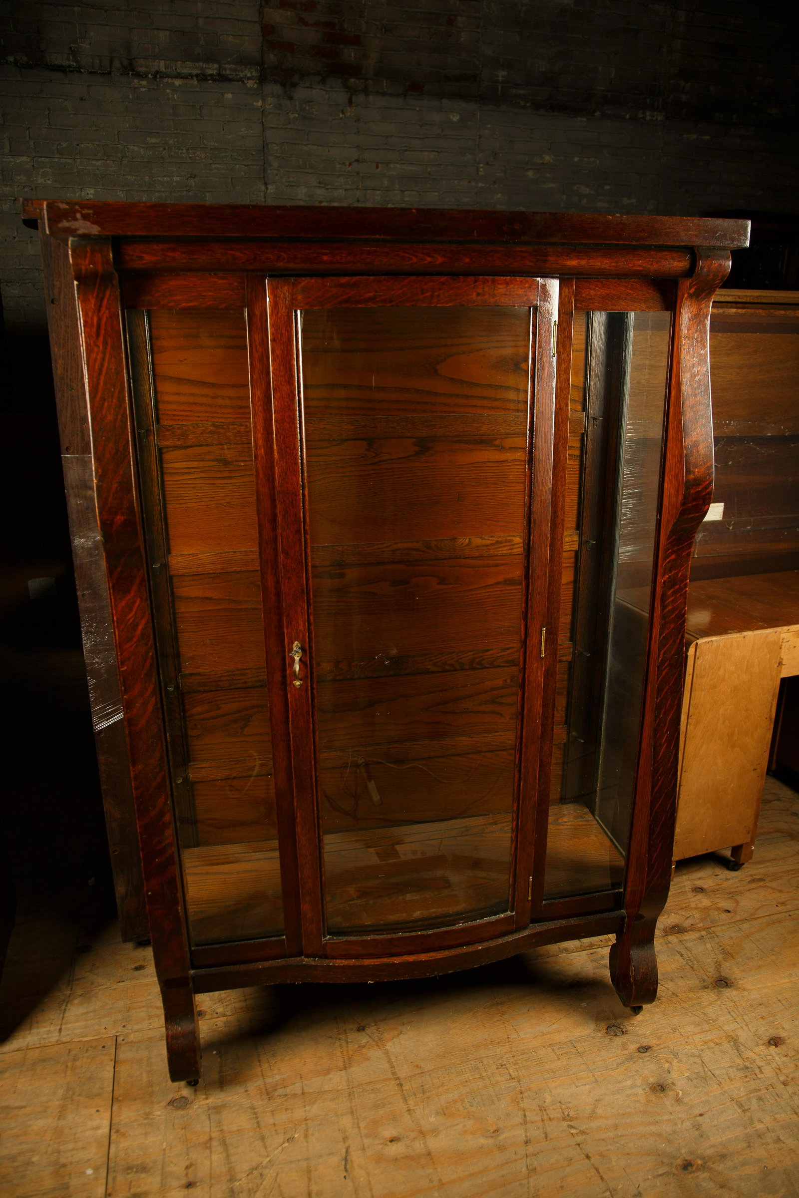 Late 19th C Golden Oak Curio Cabinet: Late 19th century golden oak curio cabinet measures 65" H x 43" W x 17" D and has four shelves, plus key. Furniture Pick-up Availability-We will have staff available at our Hay Street Location on Thur
