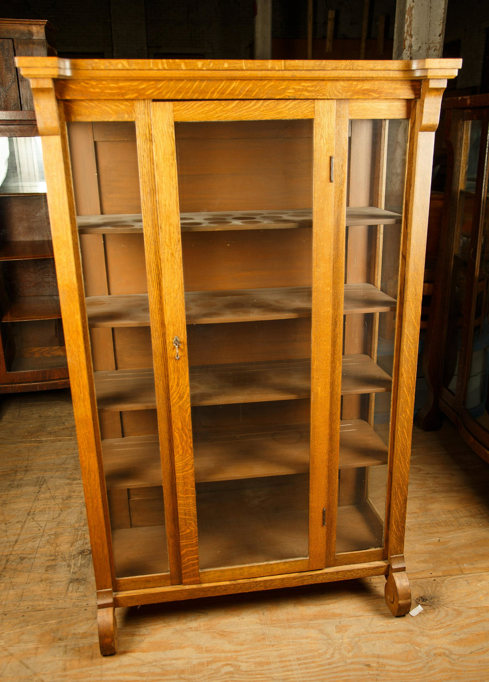 Late 19th C Oak Curio Cabinet: Cabinet measures 62 1/2" H x 39" W x 17" D and has four shelves. Furniture Pick-up Availability-We will have staff available at our Hay Street Location on Thursday the 20th and Friday the 21st or Thur