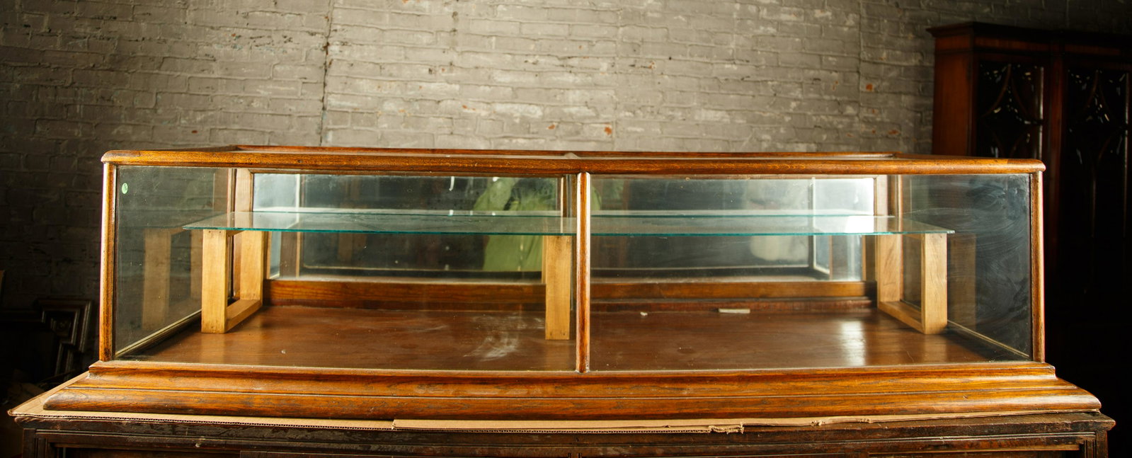 Oak Countertop Display Case: Oak countertop display case measures approx. 18" H x 72" W x 26 1/2" D and has a single glass shelf. Furniture Pick-up Availability-We will have staff available at our Hay Street Location on Thursday 