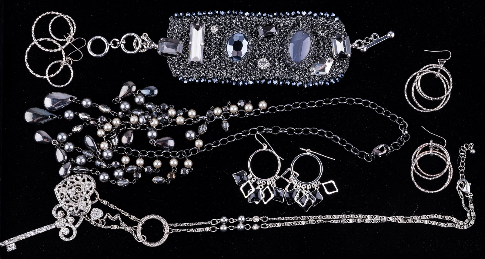 Costume Jewelry: Lot includes RUSH by Denis & Charles woven metallic bracelet (approx 7.5" L), three pairs of earrings and two necklaces including a long necklace with heart and key.